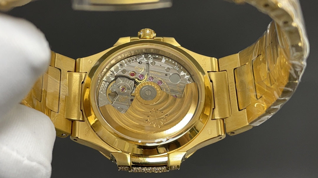 Patek Philippe Nautilus 7010 – “Gold Iced Out” (aftermarket) — Patek Philippe